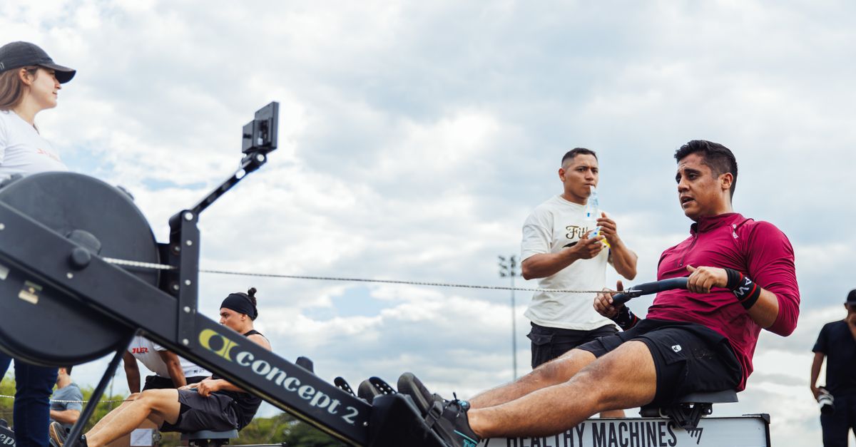 Group outdoor workout with rowing machines in Armenia, Colombia, highlighting fitness culture.